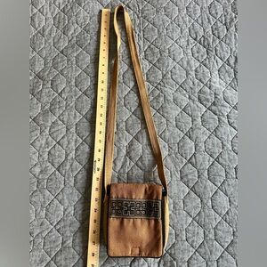 Small cross-body purse bag with multiple pockets.